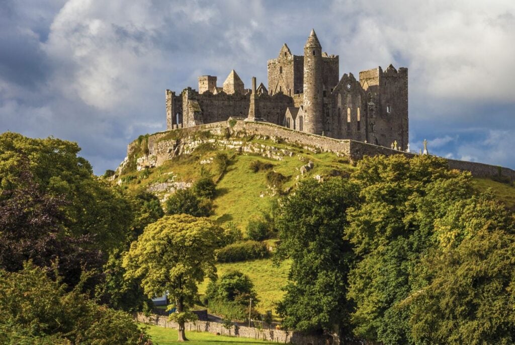 Castle in Ireland on green hill 
