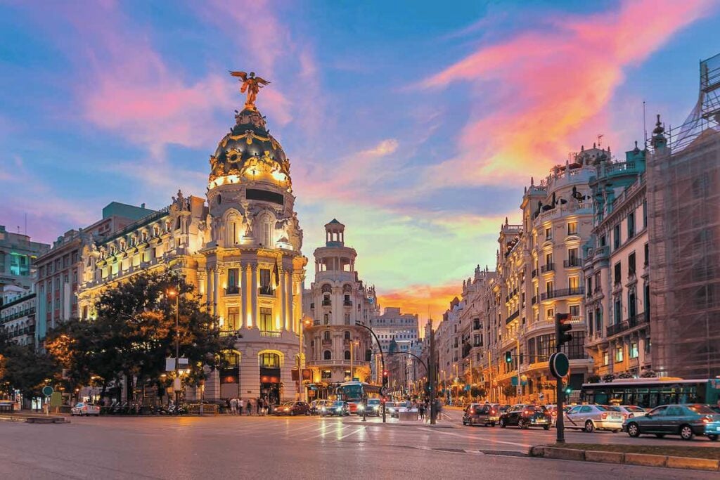 Spain Gran Via iconic street at sunset. 