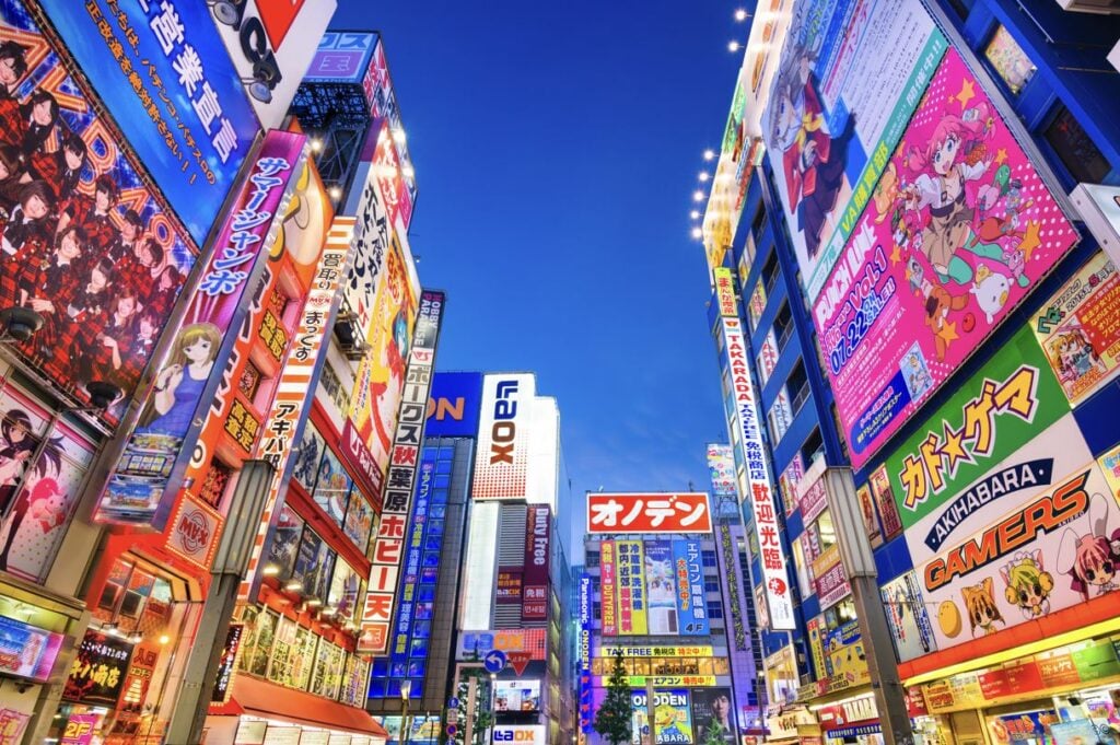 Busy street in Tokyo Japan with neon lights